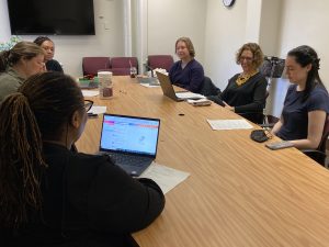 Paja and students around a table